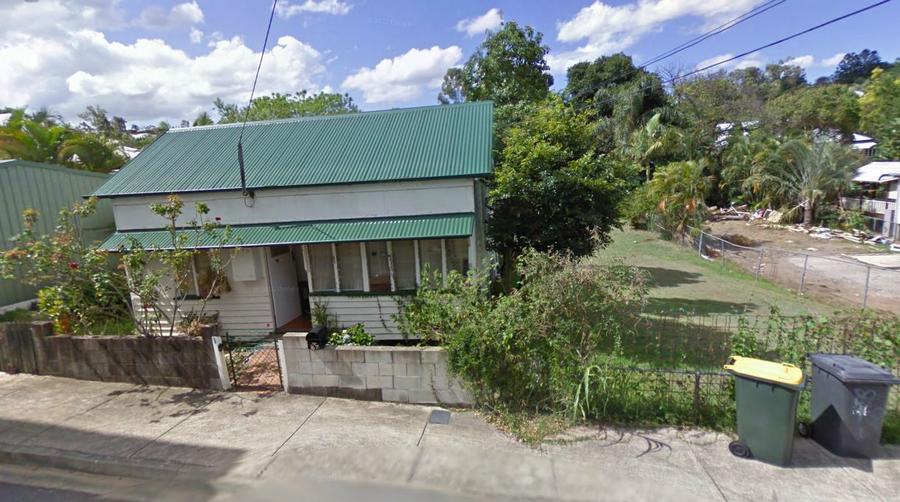 Google Street view photo from 2009 showing the house at 67, the vacant lot next door at 65 and a cleared area that used to be 63 (now rebuilt).