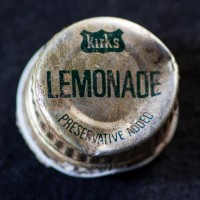 A lid from a bottle of kirk's lemonade.