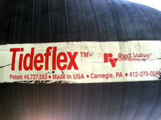 A sticker showing the manufacturer of the two big duckbill valves.