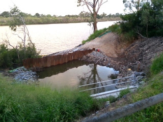 A temporary dam at the outlet of the Leybourne Street drainage system, where the duckbill valves will be installed.